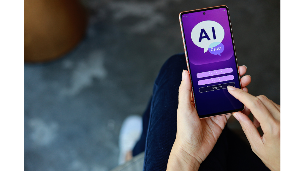 スマートフォンを操作している人がいて画面にはAI CHATと表示されている写真